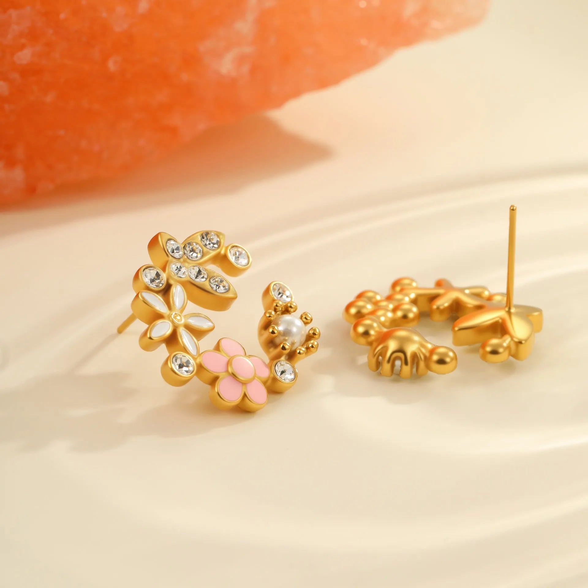 Flower shaped stud earrings with petal design in 18K gold plated stainless steel