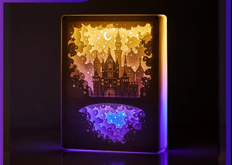Bedside night light with paper carving design, remote control, and USB power cable