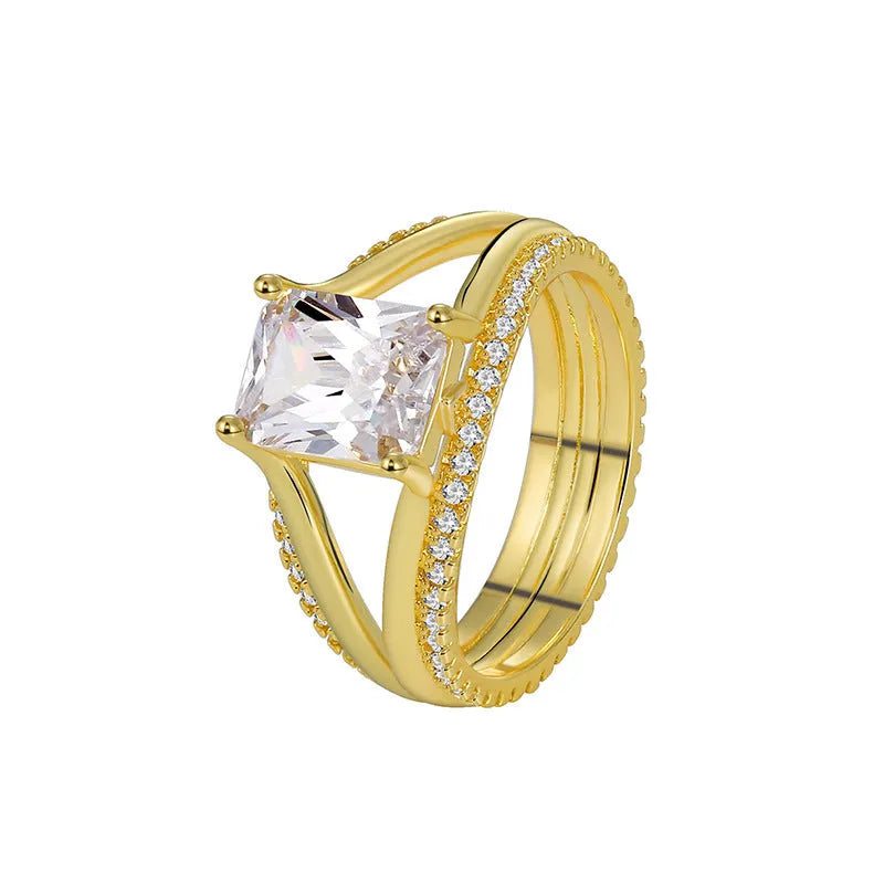 Geometric women's ring with gold electroplated finish and square zircon centrepiece on copper base