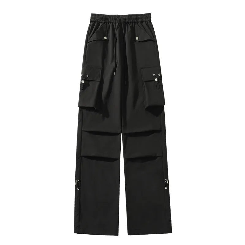 Women's plus size loose fit waterproof trousers in black, grey, or white, featuring a straight leg and elastic drawstring waist.