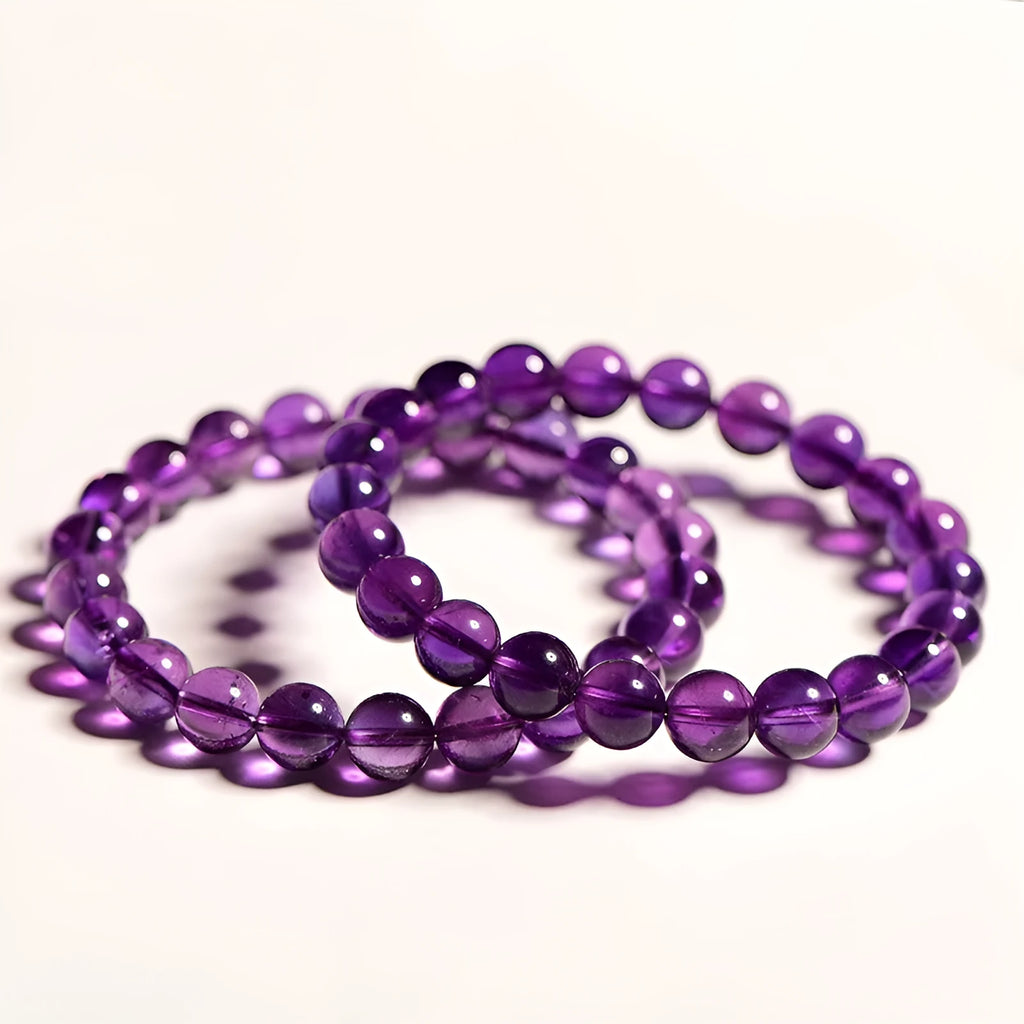 Natural amethyst Uruguay bracelet with scattered beads in various sizes on a wrist.