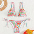 Women's lace-up split swimsuit in picture colour with a backless design and high-cut brief.