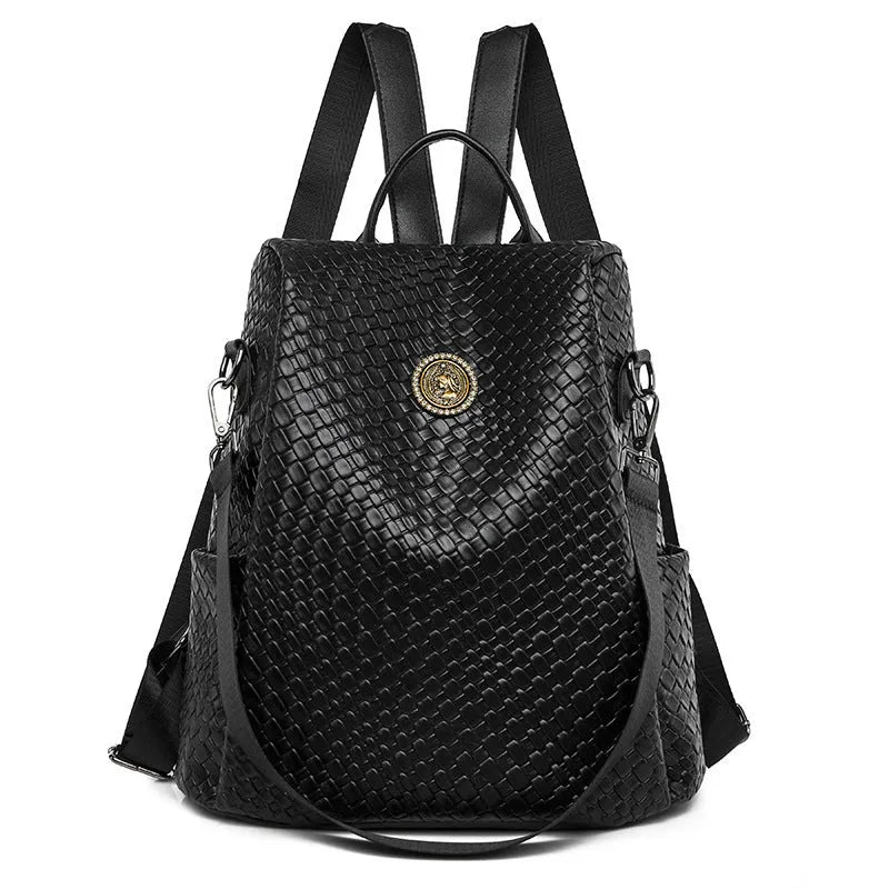 Women's black anti-theft backpack with weaving stitching detail and multiple internal compartments