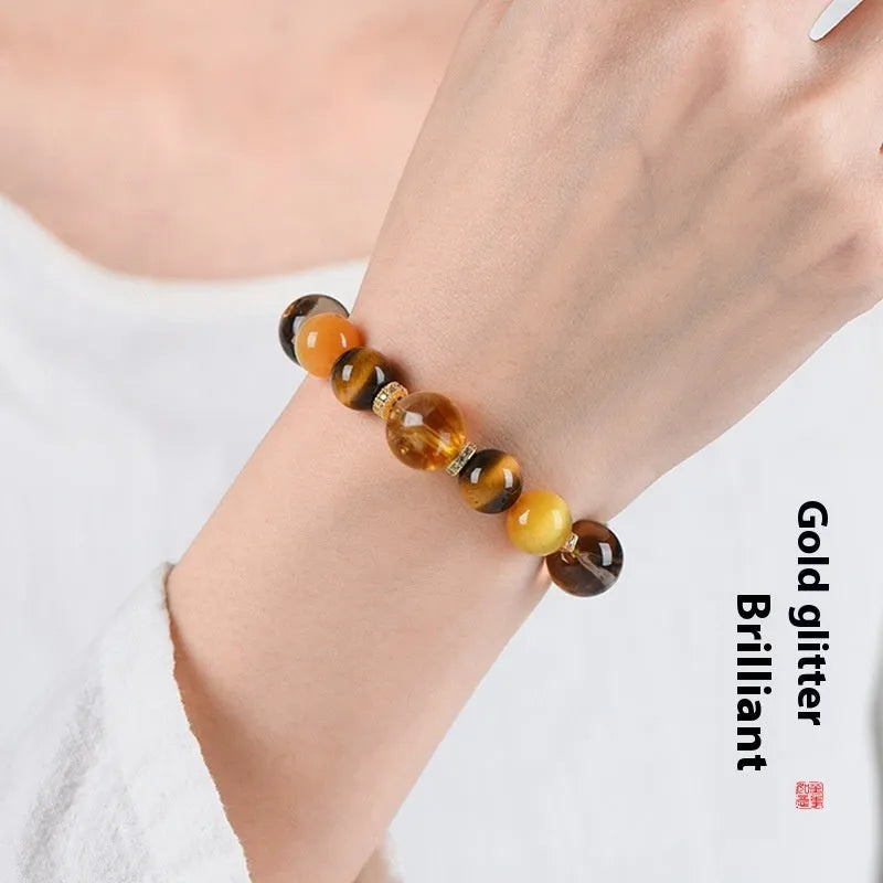 Yellow artificial crystal beaded bracelet with 10mm tower-shaped beads on wrist