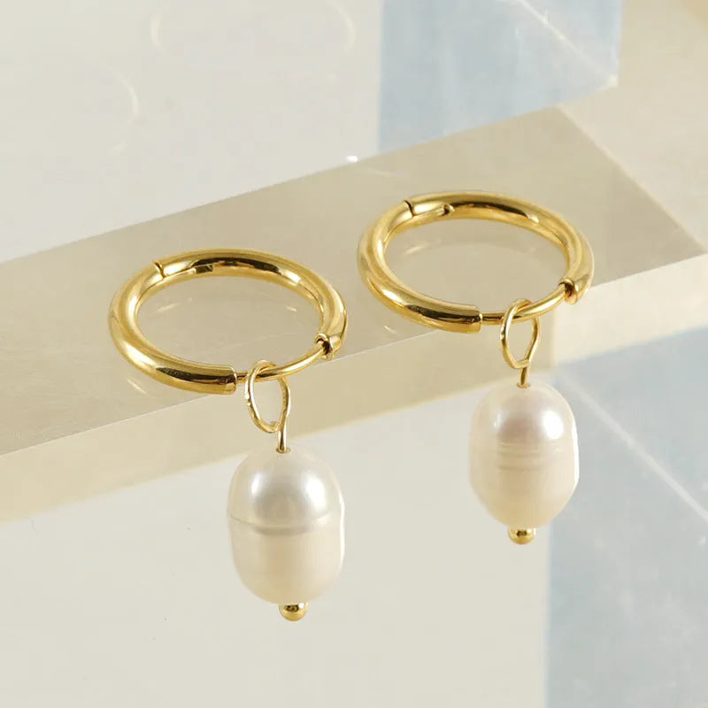 Gold geometric pearl earrings for women made from stainless steel with electroplated finish.