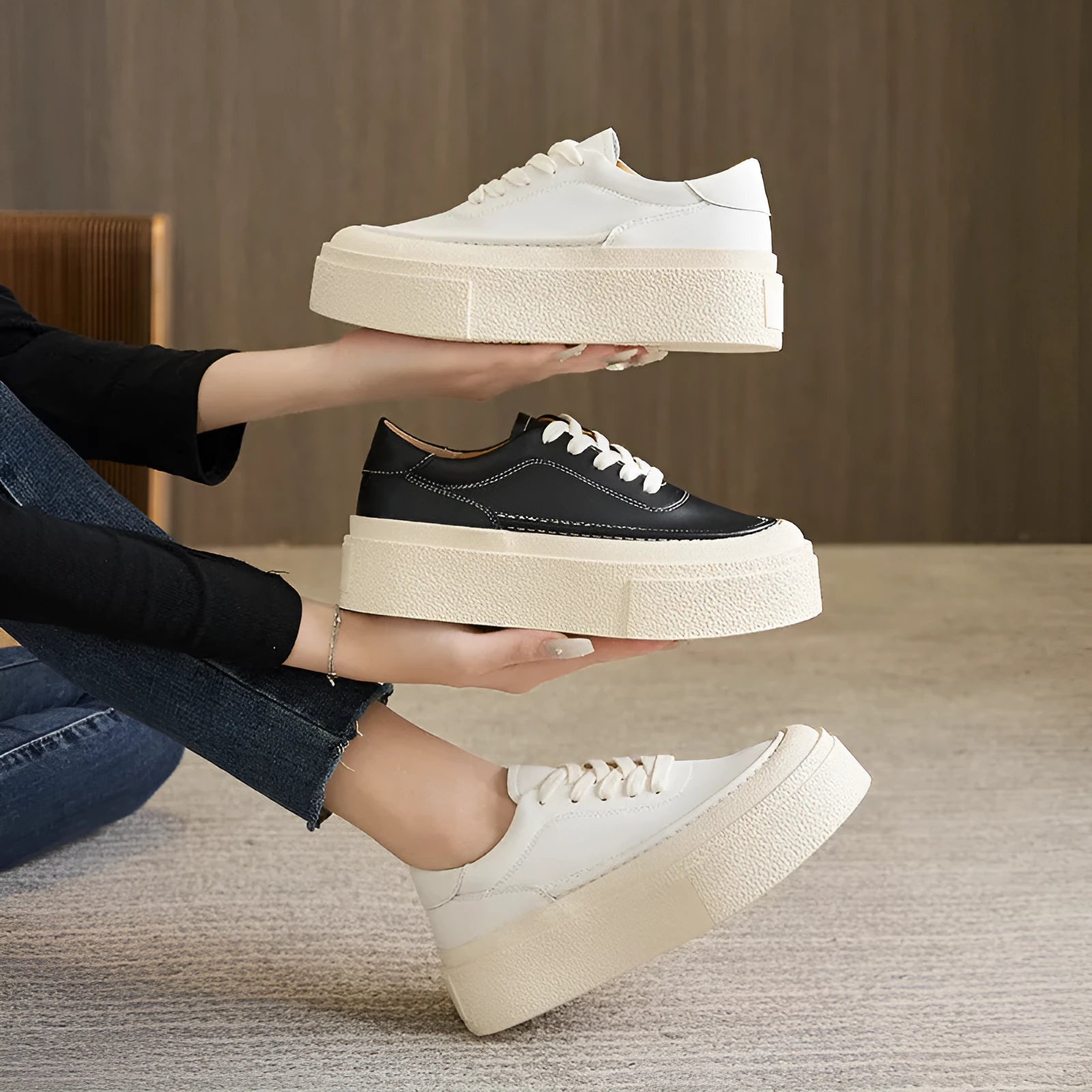 Women's black platform casual sports shoes with embossed leather upper and round toe.
