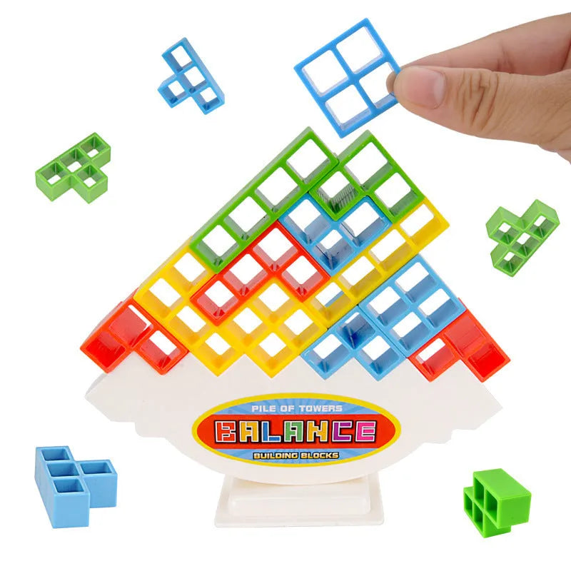 Plastic balance stacking game with 16 coloured blocks, chassis and base on table