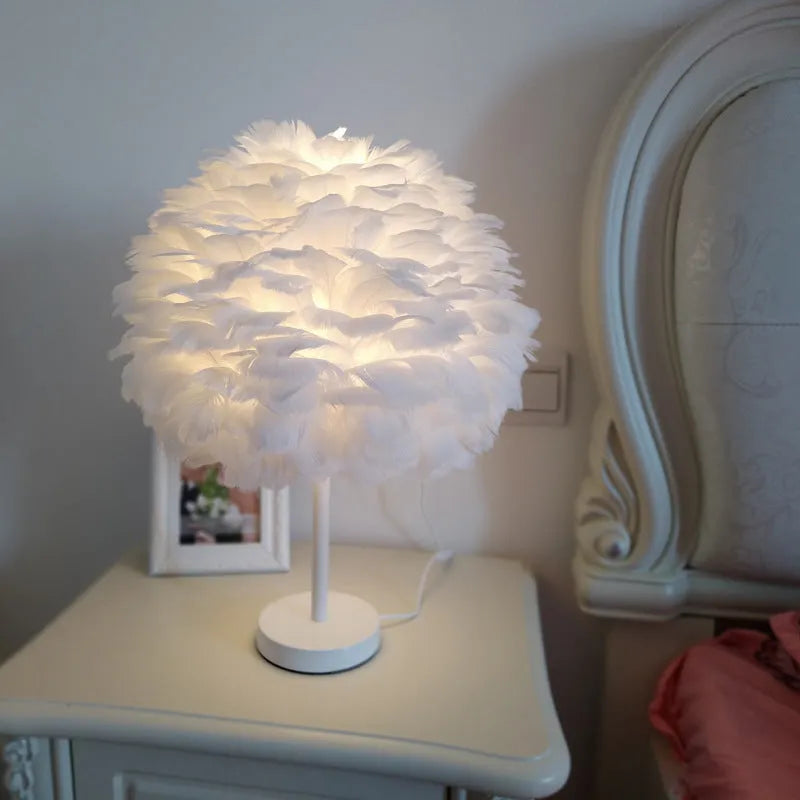 Handmade feather table lamp with metal base, available in white colour, approximately 30cm diameter and 40cm height