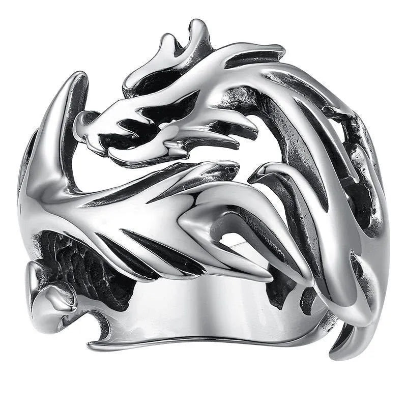 Close-up of an adjustable silver blue and green metal ring with a Chinese dragon pattern.