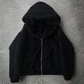A simple black loose-fit cardigan coat for men and women with long sleeves
