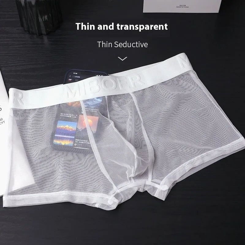 Men's thin polyester boxer shorts in six solid colours on a white background.