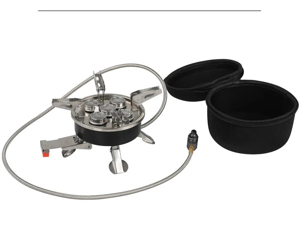 Silver portable folding camping gas stove made of stainless steel and copper with a long black hose.