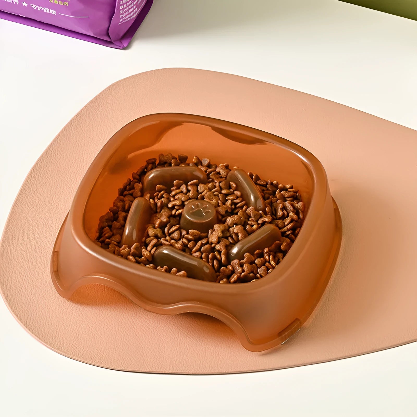 Blue plastic dog slow feeder bowl with anti-choking design on white background