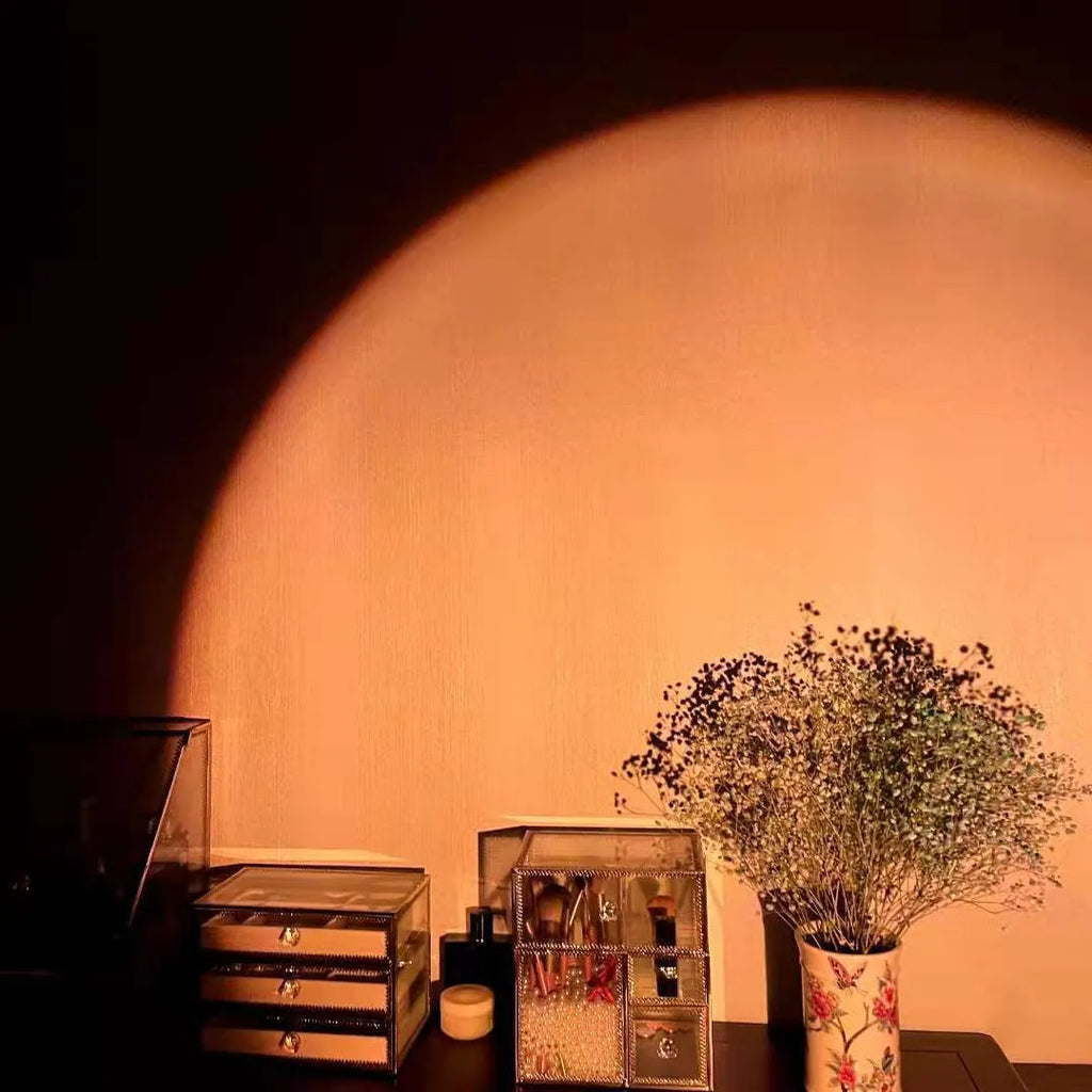 Rechargeable sunset red projection lamp with USB power connection and rainbow lighting effects