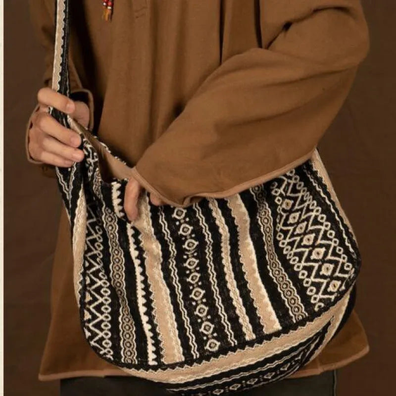Retro striped corduroy messenger bag with adjustable plaid shoulder strap and zipper closure