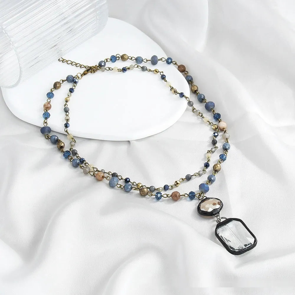 Tribal style two-layer chain necklace with natural stone and glass pendant