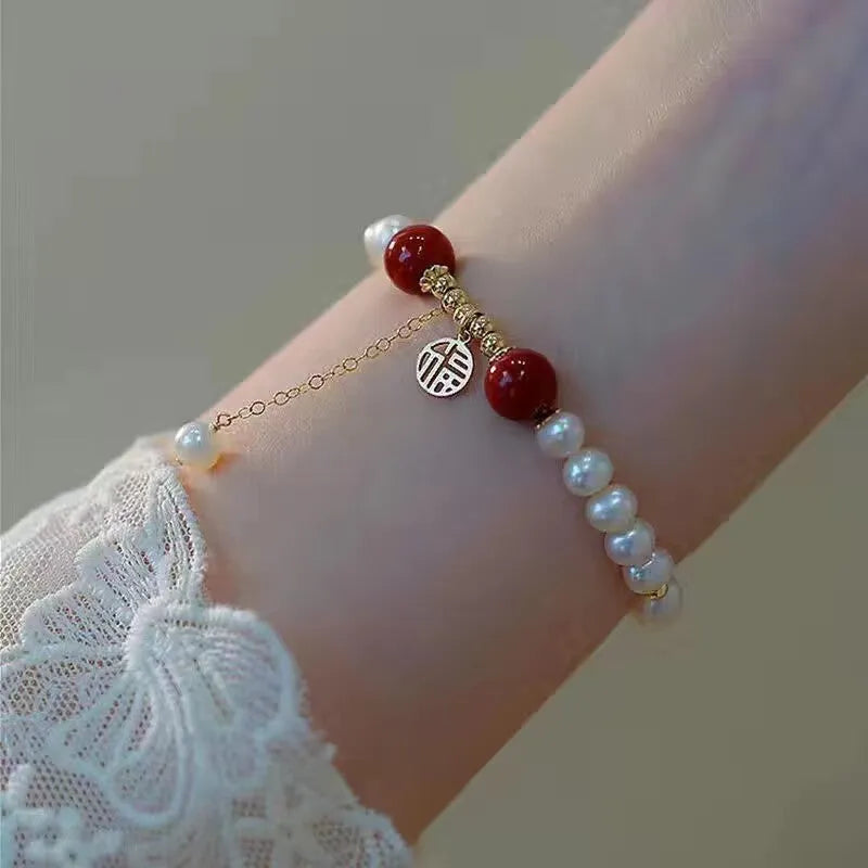 Handmade Chinese style glass bracelet with bamboo joint beads in a red Lvzhu Duobao design.