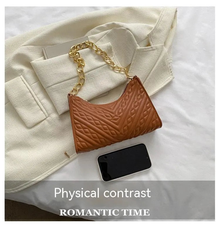 Brown pleated chain shoulder bag showing vertical square shape and adjustable strap