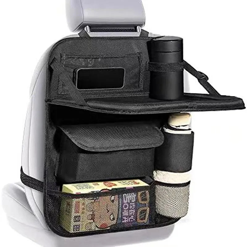 Black Oxford cloth car seat organiser bag hanging on a car seat, showing its storage pocket and hooks.