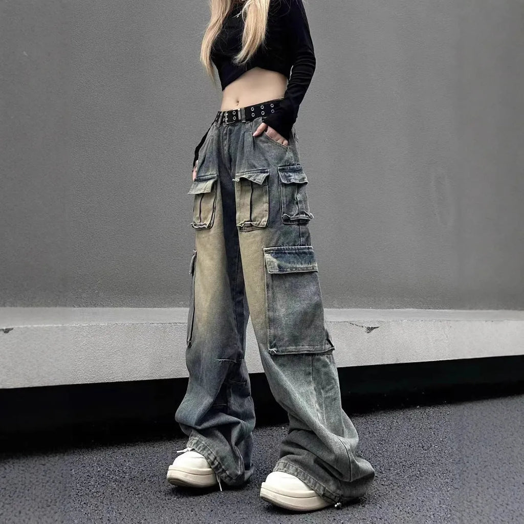 Loose-fit distressed denim jeans with multiple tooling pockets in light blue colour