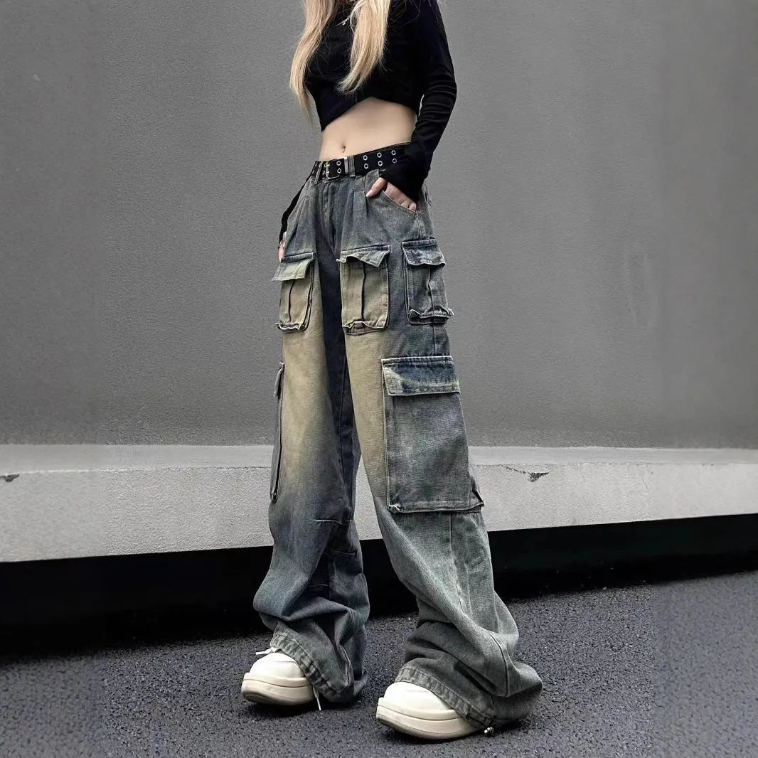 Loose-fit distressed denim jeans with multiple tooling pockets in light blue colour