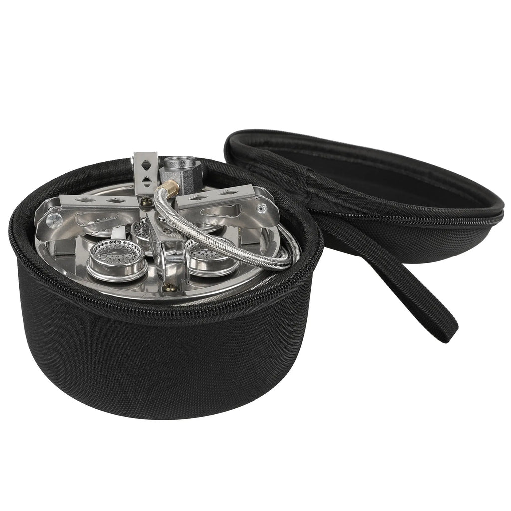 Silver portable folding camping gas stove made of stainless steel and copper with a long black hose.