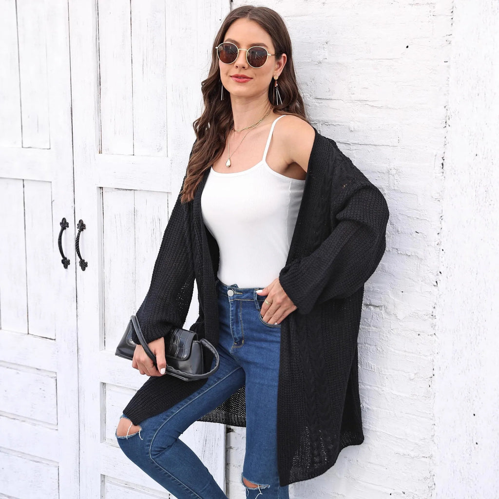 Women's loose acrylic sweater coat in army green, shown as a layering piece.