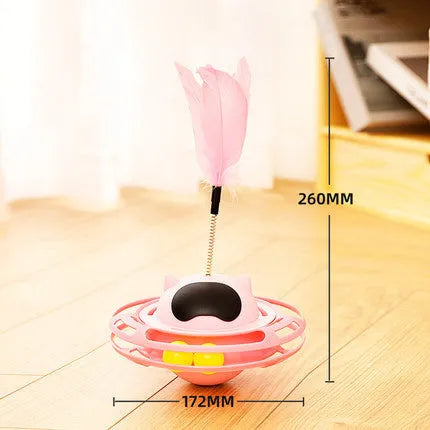 Pink stick-shaped cat toy turntable tumbler with self-hi feature on flat surface