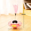 Pink stick-shaped cat toy turntable tumbler with self-hi feature on flat surface