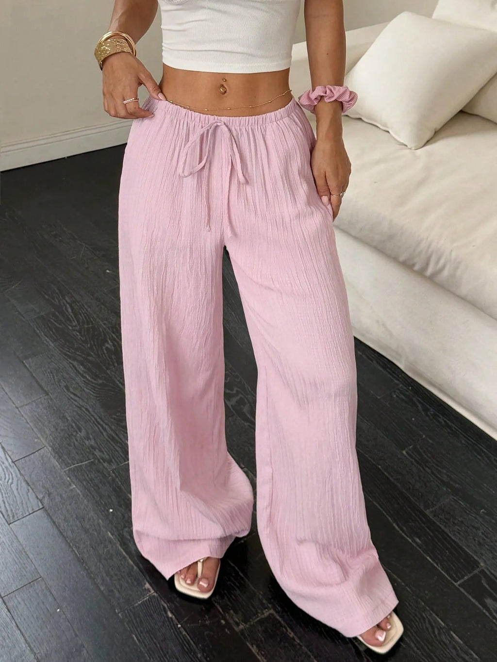 Women's black wide-leg trousers with lace-up waist detail