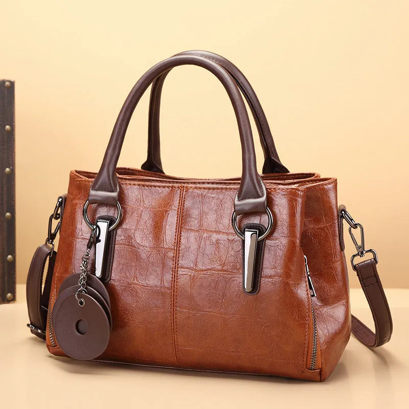 Horizontal square PU leather shoulder bag with single strap showing internal organiser compartments