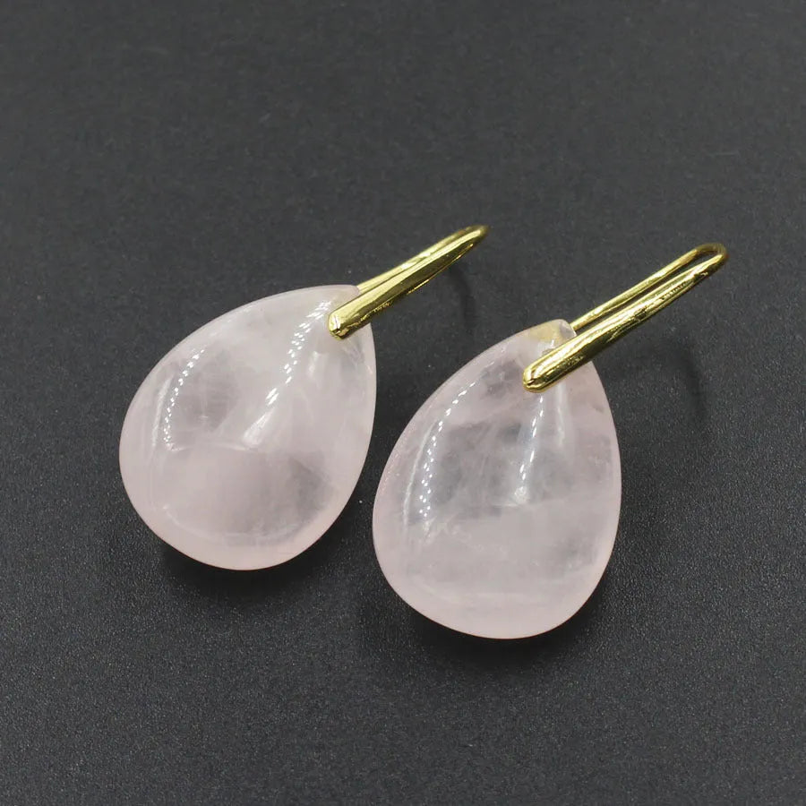 Geometric crystal water drop earrings in amethyst colour with electroplated metal setting.