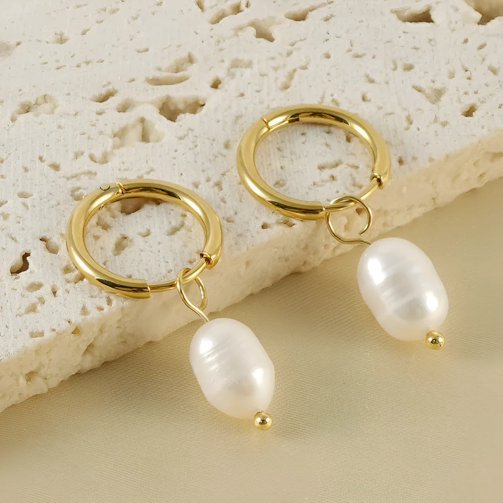 Gold geometric pearl earrings for women made from stainless steel with electroplated finish.