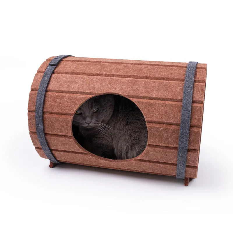 Assembled wine barrel shaped cat bed made from grey polyester fibre felt.