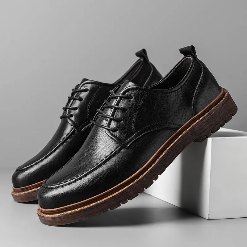 Men's black and brown casual leather shoes with round toe and flat rubber sole.
