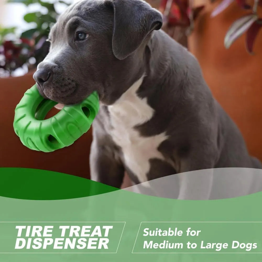 Blue rubber tyre-shaped dog chew toy with oval openings, shown next to dog treats.