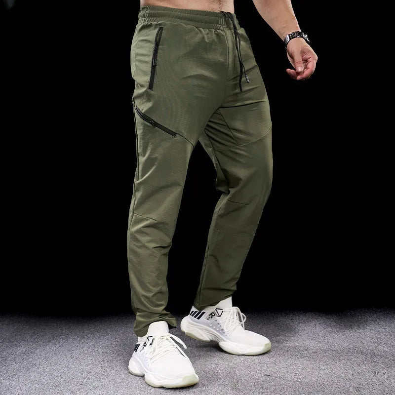 Men's black waterproof quick-drying nylon workout trousers for sports and exercise