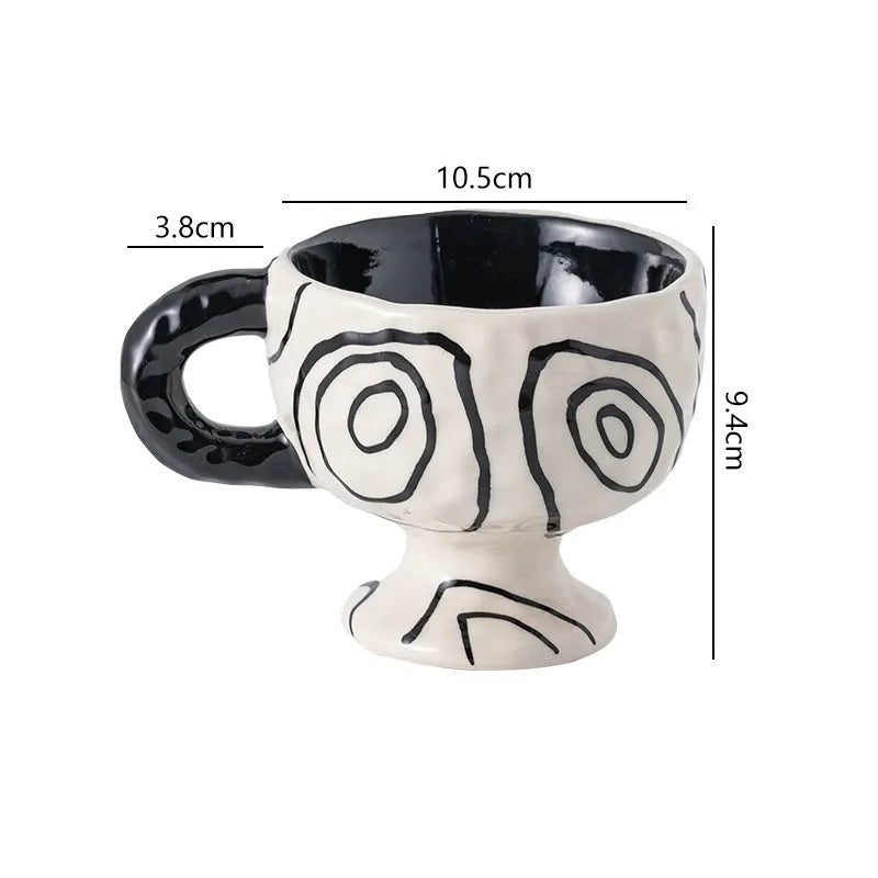 Hand-pinched irregular ceramic mug with modern minimalist design in solid colour