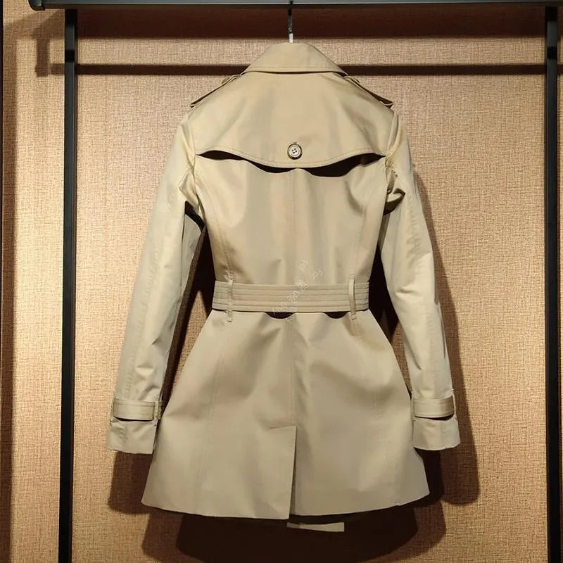 Khaki double-breasted trench coat for women with flight sleeves, shown on a hanger.