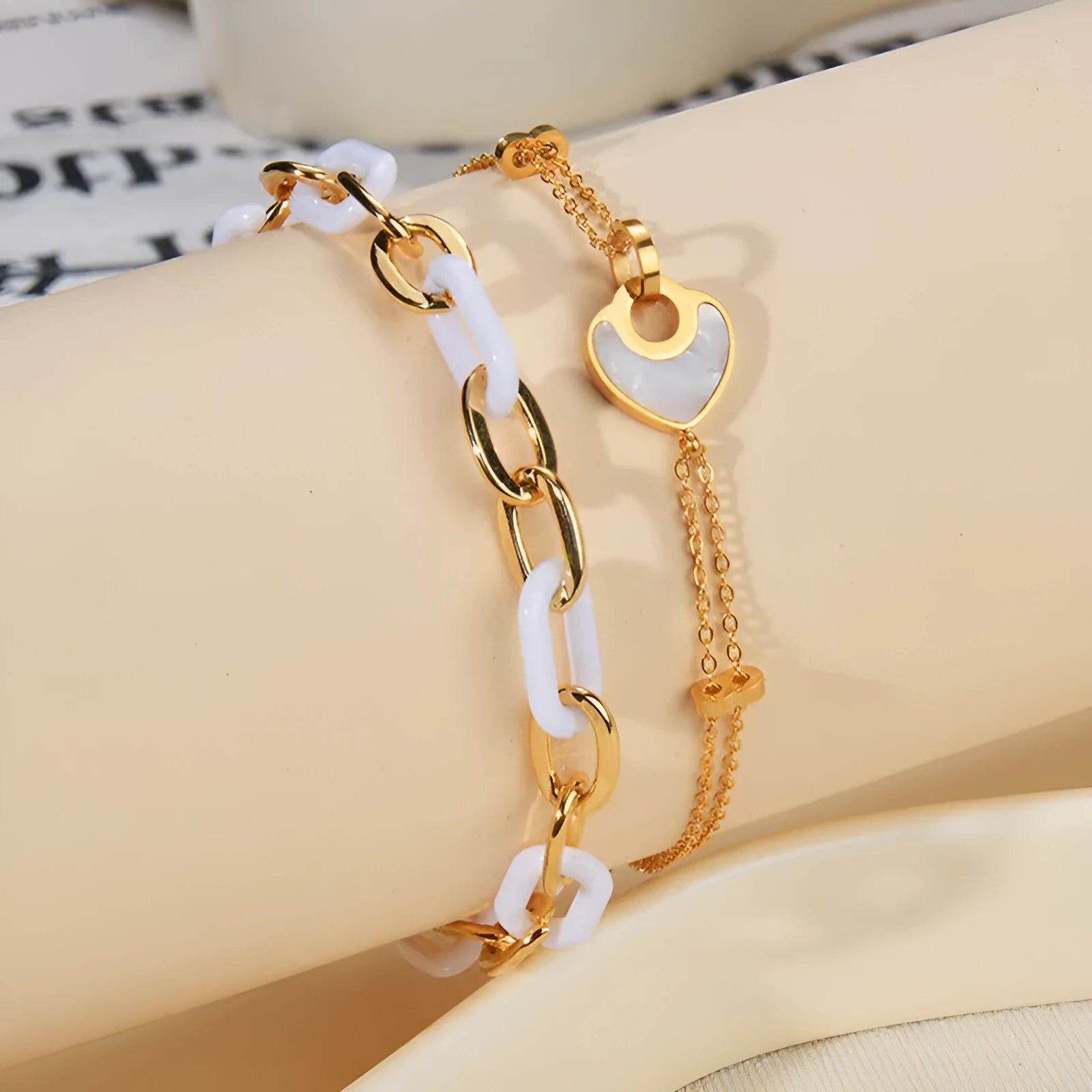 Ins style stainless steel and resin bracelet with a double-layered heart charm.