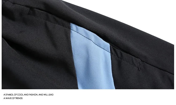 Quick-drying black and grey sports shorts with elastic waist and loose straight-leg design