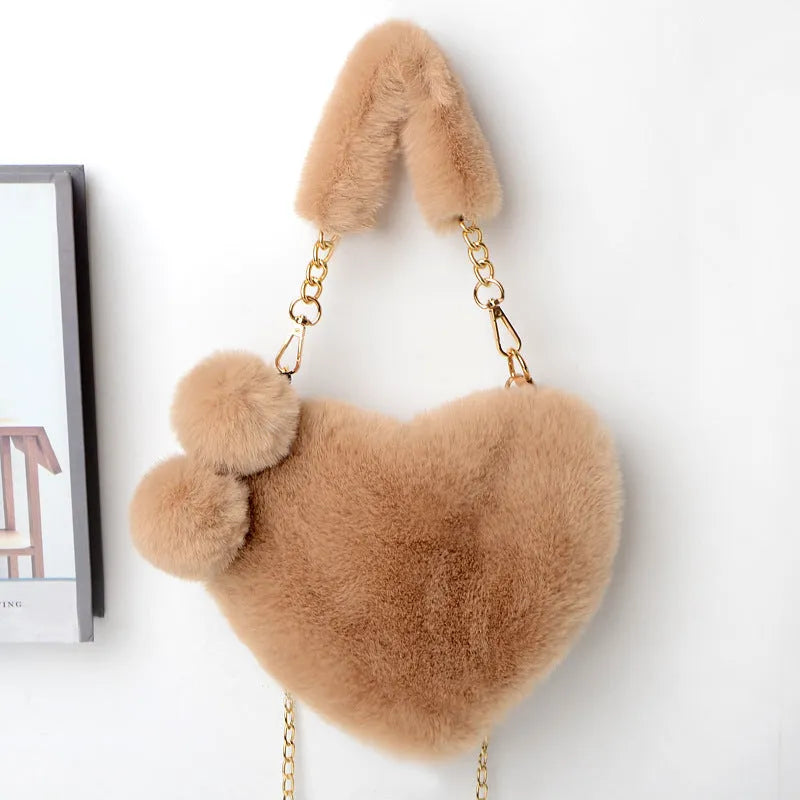 Heart-shaped women's plush handbag with soft texture and detachable shoulder strap in medium size