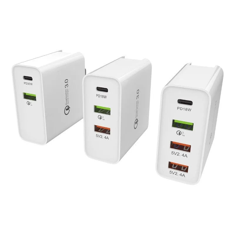 White fast charge mobile phone charger with multiple USB ports showing UK plug