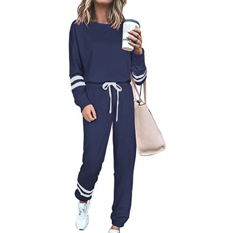 Women's loose-fitting casual suit set in a solid colour, comprising a long-sleeve top and matching trousers.