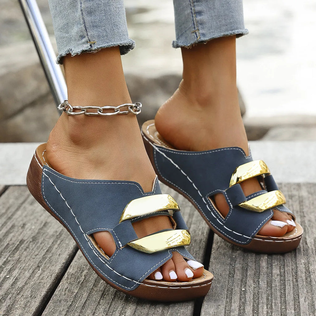 Roman style platform sandals in black, white, khaki, and sea blue colours on a rubber sole.