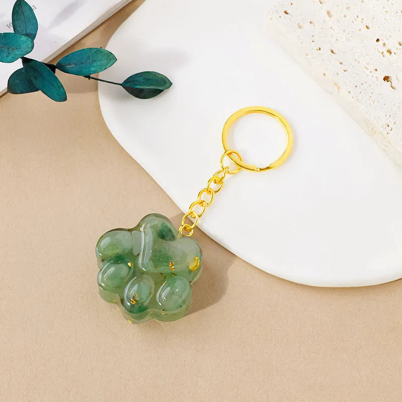 Natural crystal cat's paw keychain pendant charm in one of ten crystal types including pink crystal and amethyst.
