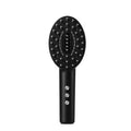 Black handheld scalp massage device with charging cable for vibration therapy