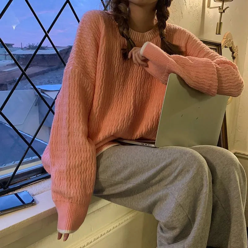 Women's loose pullover sweater in solid colour polyester fabric showing front view