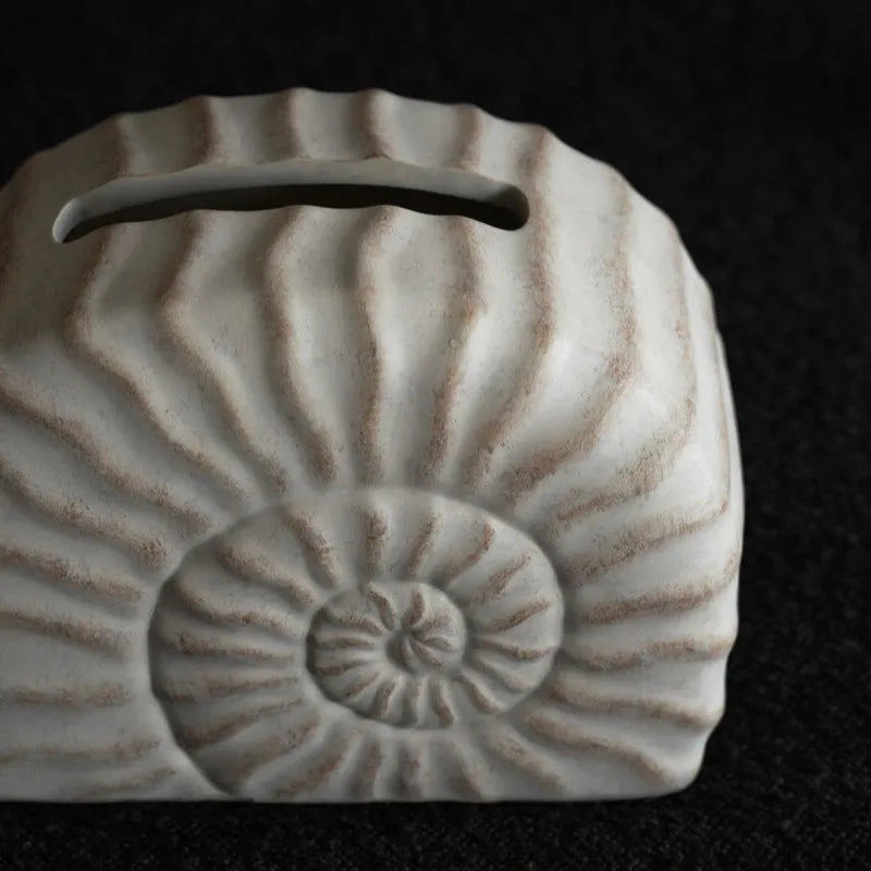 A modern conch ramble coloured resin tissue box for home or office desk organisation.