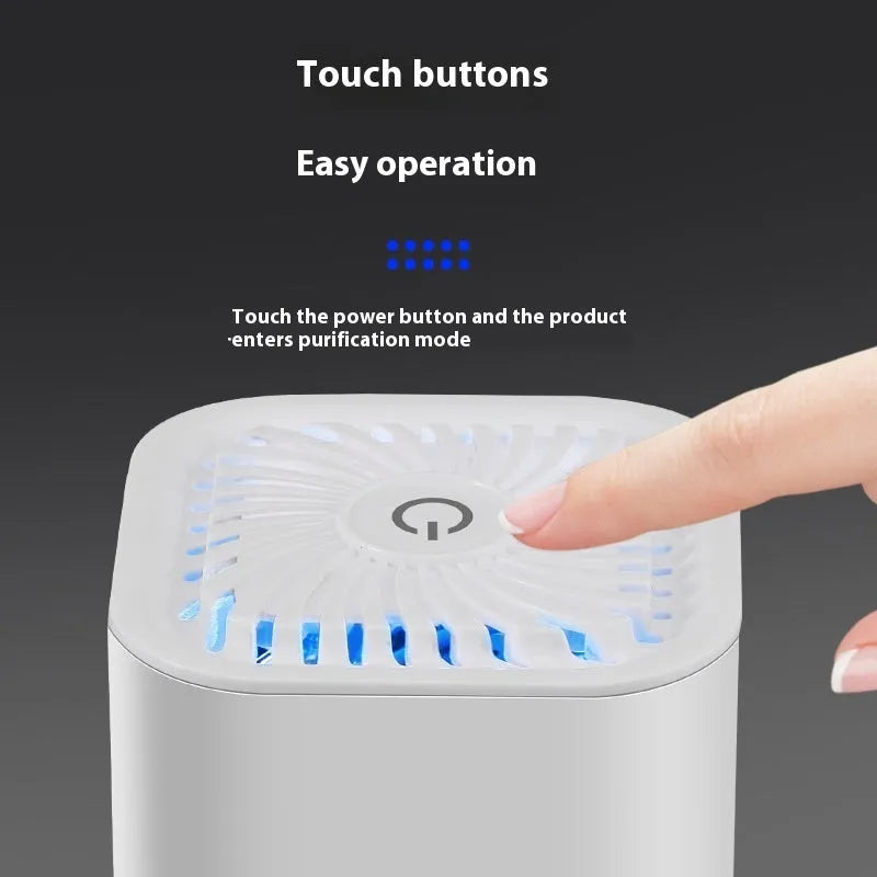 Mini black and white USB car air purifier with filter for small spaces.